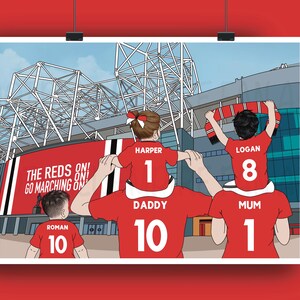 May include: Illustration of a family of four wearing red jerseys with white numbers, standing in front of a stadium. The text "THE REDS ON! GO MARCHING ON" is visible. The family is likely attending a soccer game.