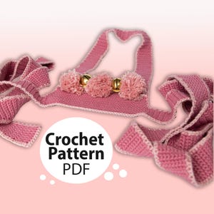 Puede incluir: Collar de gato de crochet rosa con cascabeles dorados y pompones. Patrón de crochet PDF.
