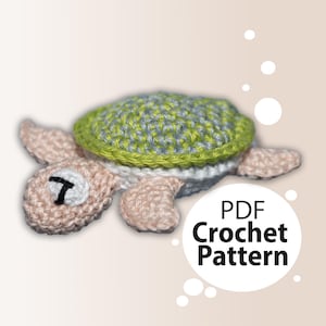 May include: A crochet pattern for a small, pink and green turtle. The pattern is available as a PDF download.