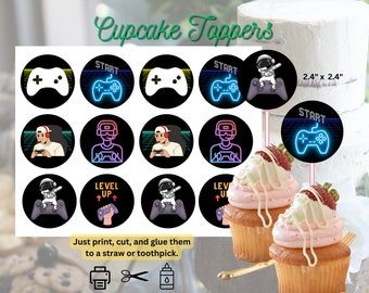May include: A collection of black cupcake toppers with gaming-themed designs. Each circular topper features a controller, gamer, or astronaut graphic with neon accents. The text "START" and "LEVEL UP" are also included. The toppers are 2.4" x 2.4".