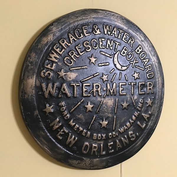 Unique wall art, famed, vintage New Orleans water meter cover