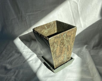 Repurposed slate as a cut flower vase with base. 8 1/2” high, 5 1/4” wide.