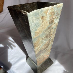 Repurposed weathered natural roofing slate beautifully shaped as a vase for cut flowers.