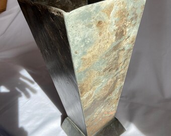 Repurposed weathered natural roofing slate beautifully shaped as a vase for cut flowers.