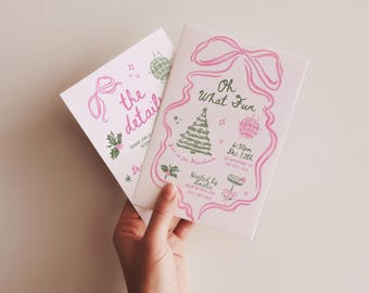 May include: Two white invitation cards with pink and green illustrations. One card reads "the detail" with a bow and holly. The other says "Oh What Fun" with a Christmas tree, disco ball, and event details. The cards are held by a hand.