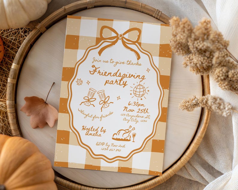 May include: An invitation for a Friendsgiving party with a gingham background. The invitation has a decorative border and includes the text "Join us to give thanks Friendsgiving party" and event details. The invitation is on a wooden tray.