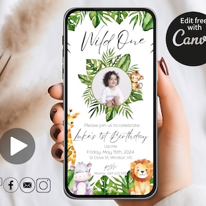 May include: A digital invitation for a first birthday party with a jungle theme. The invitation features a photo of a child in a green circle surrounded by green leaves and jungle animals. The text reads "Wild One" and "Luke's 1st Birthday".