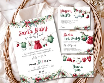 May include: A Christmas-themed baby shower invitation with a red and white color scheme. The invitation features a Santa Baby theme with a line of baby clothes hanging on a clothesline. The text reads "Santa Baby is almost here!" and includes details about the shower, including the date, time, and location.