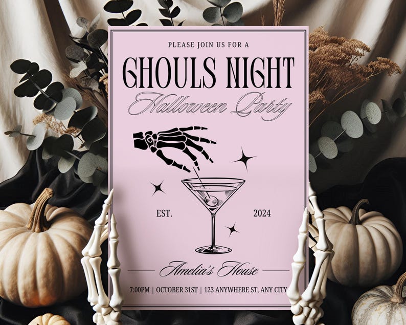 May include: A pink invitation card with black text that reads "Please join us for a Ghouls Night Halloween Party". The card features a black skeleton hand holding a martini glass with an olive. The text "EST. 2024" is below the martini glass. The text "Amelia's House" is below the martini glass. The text "7:00PM | OCTOBER 31ST | 123 ANYWHERE ST, ANY CITY" is at the bottom of the card.