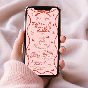 May include: A pink and red digital invitation on a smartphone screen for a Mother's Day brunch and bubbles event. The invitation includes the date, time, and location of the event, as well as a request to RSVP by May 2nd. The invitation is in honor of Amelia.