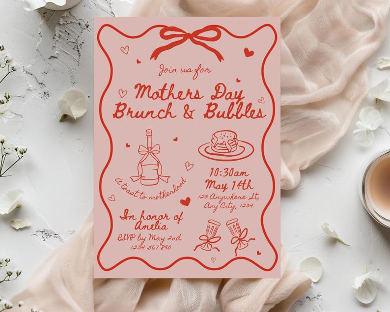 May include: Pink invitation with red text and illustrations for a Mother's Day brunch and bubbles event. The invitation includes the date, time, and location of the event, as well as a request to RSVP by May 2nd. The text reads "Join us for Mother's Day Brunch & Bubbles, 10:30am May 14th, 123 Anywhere St, Any City, 1234, A toast to motherhood, In honor of Amelia, RSVP by May 2nd, 1234 567 8910."