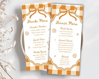 May include: Two rectangular menu cards with a fall theme. The cards have a light orange and white gingham pattern at the top and bottom. The text on the cards includes "Drinks Menu" and "Dinner Menu" with a list of menu items.