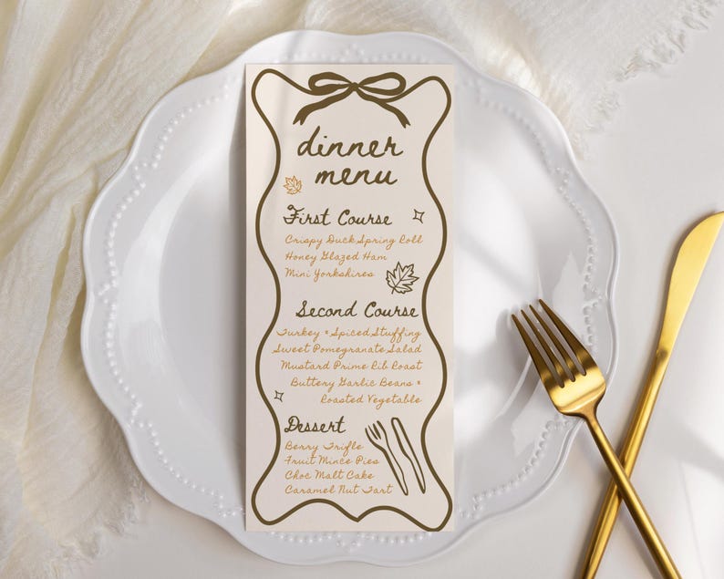 May include: A dinner menu card with a decorative border and bow design, listing courses like Crispy Duck Spring Roll and Benny Trifle. The card is on a white plate with gold cutlery.