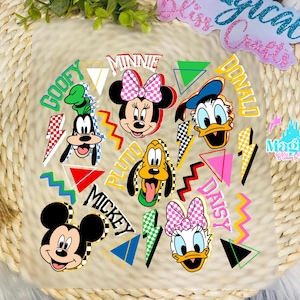 May include: A collection of cartoon character faces, including Mickey, Minnie, Donald, Daisy, Goofy, and Pluto, with their names in colorful, stylized text. Geometric shapes and lightning bolts surround the characters.