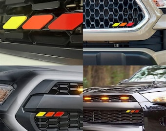 Trójkolorowy emblemat na grill do Toyoty Tacoma 4 Runner Tundra Sequoia Rav4 Highlander