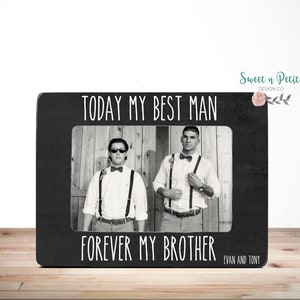May include: Black and white photo of two men in a picture frame. The frame has a black background with white text that reads "TODAY MY BEST MAN FOREVER MY BROTHER EVAN AND TONY".