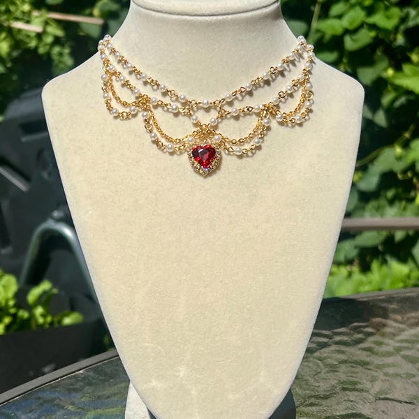 red crystal heart golden chain and pearl collar