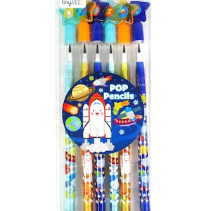 May include: A set of six colourful pop pencils with a space theme. The pencils have a clear plastic body with a blue, orange, or yellow top. The pencils are decorated with stars, planets, and rockets. The packaging says "POP Pencils" and "6 PCS".