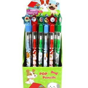 May include: A display box of 24 colorful pop pencils with dog illustrations. The pencils have star-shaped toppers in red, blue, and green. The box has a green background with a dog house and a dog on it. The text on the box reads "POP Pencils" and "Dog".