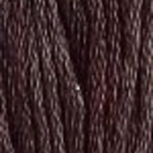 May include: A close-up of a dark brown, textured, woven cord.
