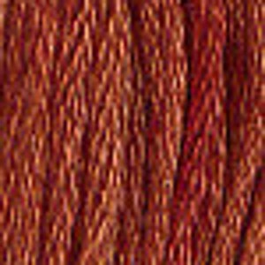 May include: Close-up of a textured, reddish-brown fabric with a subtle sheen. The fabric has a woven pattern that creates a slightly raised surface.
