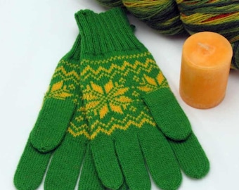 May include: Green knitted gloves with yellow snowflake patterns. A ball of green, yellow, and red yarn and an orange candle are also in the image. The gloves are a winter accessory.