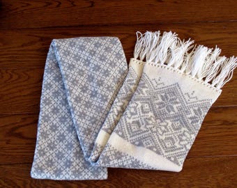 Knitted long warm winter double sided scarf with Scandinavian pattern white and gray.