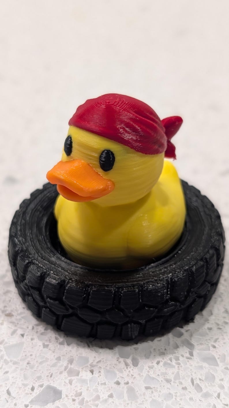 Bandana Duck in Off-Road Tire — photographed physical product
