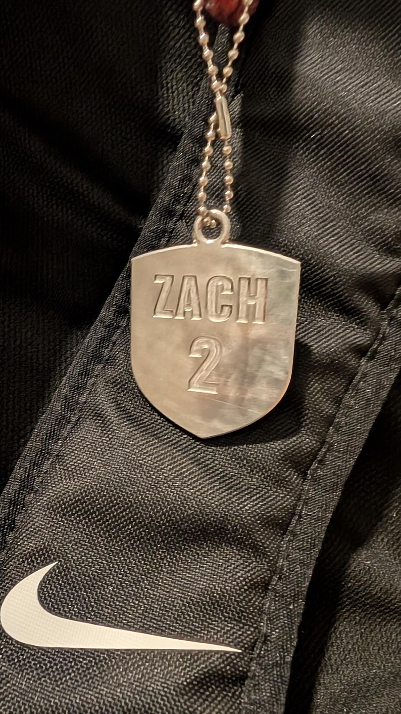 Personalized Aluminum Soccer Bag Tag — photographed physical product