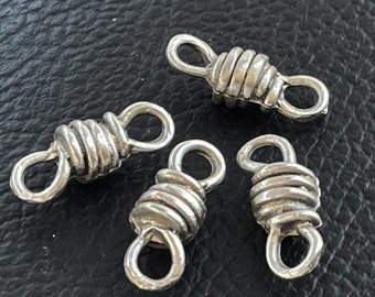 May include: Four silver-toned metal wire wrapped jump rings. Each ring has two loops on either end. The rings are designed to connect jewelry pieces together.