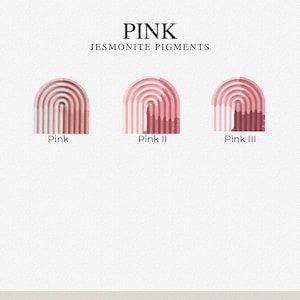 May include: Three arched Jesmonite pigment samples labeled Pink, Pink II, and Pink III. Each arch features a ribbed texture with varying shades of pink, ranging from light pastel to deep rose, displayed against a plain white background.
