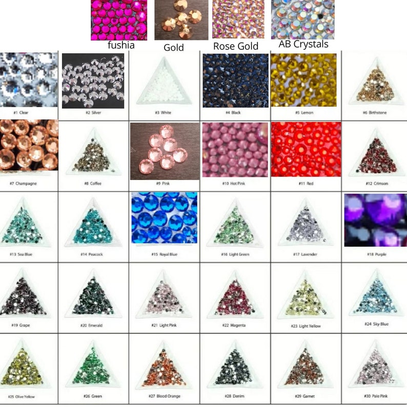 May include: A chart of 30 different colors of rhinestones, each color is displayed in a small triangle-shaped container. The colors include clear, silver, white, black, lemon, champagne, coffee, pink, hot pink, red, crimson, sea blue, peacock, royal blue, light green, lavender, purple, grape, emerald, light pink, magenta, light yellow, sky blue, olive yellow, green, blood orange, denim, garnet, and pale pink.