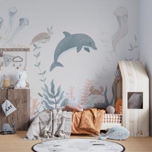 Carta da parati murale con vita marina stravagante per la cameretta dei bambini: delfini, tartarughe, meduse e coralli ad acquerello