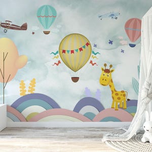Carta da parati murale per cameretta dei bambini, con mongolfiere, aerei d'epoca e simpatiche giraffe.