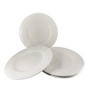 May include: Set of four white ceramic dinner plates with a subtle ribbed design.