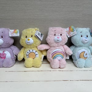ケアベア ベビー - ぬいぐるみソフトトイ - 初めてのインタラクティブ感覚ラトルぬいぐるみ 12インチ 新品タグ付き - 選べる種類、個別販売