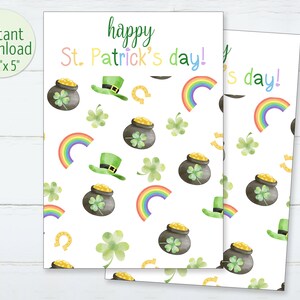May include: Two St. Patrick's Day themed cards with a white background. The cards feature a pattern of rainbows, pots of gold, green hats, horseshoes, and clovers. The text "happy St. Patrick's day!" is written in colorful letters. The cards measure 3.5" x 5".