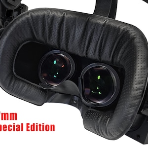 May include: Close-up of a black VR headset with a 17mm special edition label. The headset has a black leather-like faceplate with a textured surface and two lenses.