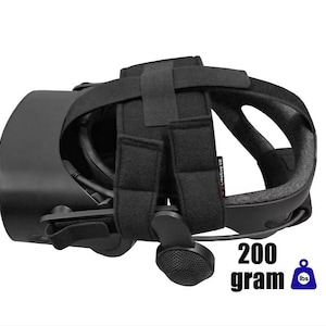 May include: Black VR headset with adjustable straps and a built-in microphone. The headset is designed for virtual reality experiences. The image includes the text "200 gram" and a small icon of a weight scale.