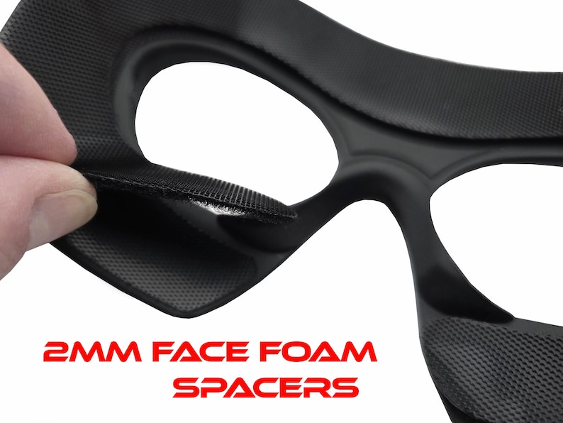 May include: Close-up of a black foam spacer with a textured surface. The text "2MM FACE FOAM SPACERS" is displayed in red. The spacer is designed to fit around the eyes.
