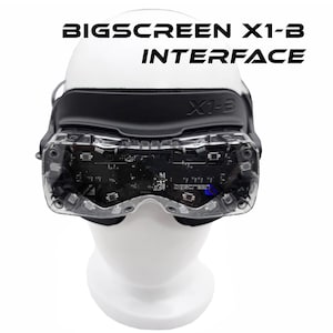 May include: A VR headset with the text "BIGSCREEN X1-B INTERFACE" in black. The headset features a black strap and clear lenses, showing internal components. It's displayed on a white mannequin head.
