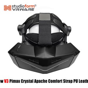 May include: A black VR headset with a comfort strap and PU leather. The headset has a futuristic design with the text "New V3 Pimax Crystal Apache Comfort Strap PU Leather" at the bottom and the "studioform VRWARE" logo at the top.