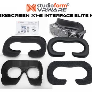 May include: A VR interface kit with the text "BIGSCREEN X1-B INTERFACE ELITE KIT". The kit includes a VR headset, several black foam face cushions, and a small card with instructions. The VR headset is black and has a clear lens.