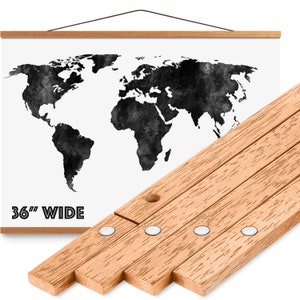 May include: A black and white watercolor world map print on canvas with a wooden hanging system. The canvas is 36 inches wide and has a wooden frame with a hanging system. The hanging system is made of wooden slats with metal clips.