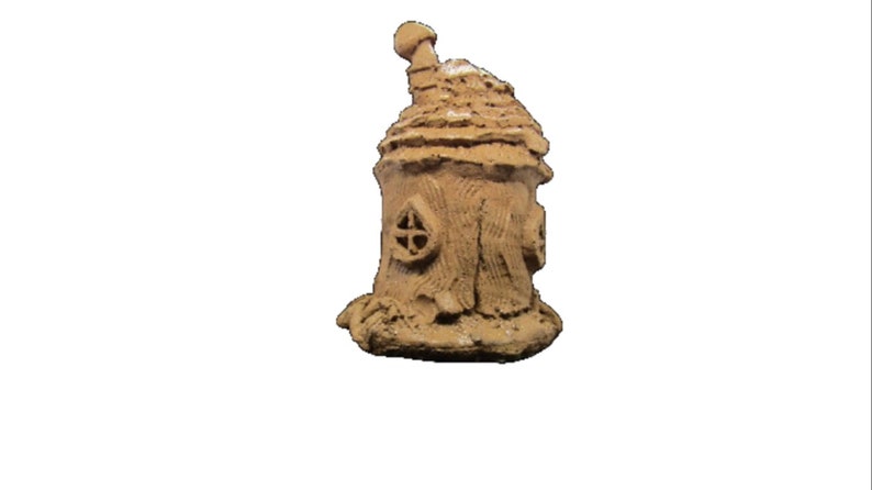 May include: A small, brown, clay fairy house with a rounded roof and a chimney. The house has a small window and is decorated with a textured surface.