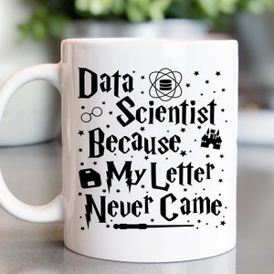May include: White ceramic mug with a black design that reads "Data Scientist Because My Letter Never Came." The design includes a wizard's hat, glasses, a wand, and a castle.