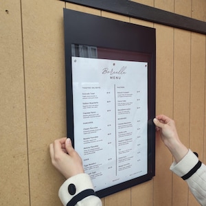 Installation accessories included with the product – wall plugs, screws, and magnets