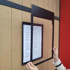 Showing transparent cover slightly open for easy menu updates