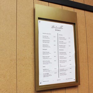 Side angle of the powder-coated menu board showing slim profile and modern design