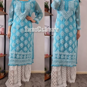 May include: A turquoise blue long-sleeved kurta with white embroidery and a white palazzo pant. The kurta has a round neckline and a button closure. The palazzo pant has a lace trim.